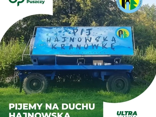 Zdjęcie cysterny z hajnowską kranówką, u dołu napis: "pijemy na Duchu hajnowską kranówkę"
